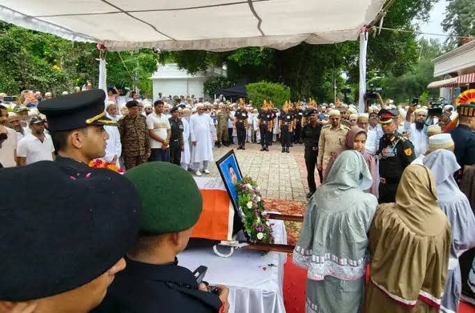 Wrapped , tricolour, Major Hamza Arif laid ,military honours